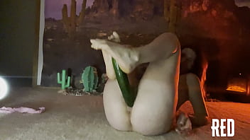 Ginger Woman Enjoys Riding A Lengthy Cucumber