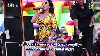 Two Gorgeous Singers Heat Up The Stage With A Wild, Seductive Dance As A Crowd Of Men Watches, Captivated