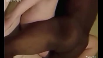 Her husband watches, stroking himself, as she takes every inch of that thick black cock deep inside her.