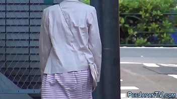 A Japanese beauty relieving herself under the open sky