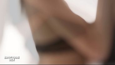 Tracy Gold and Candice Luca tangled up in bed, a steamy sapphic scene