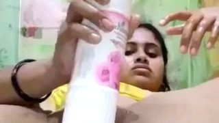 Desi babe gets wild, sliding a room freshener bottle deep inside her dripping pussy