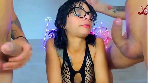 Girl with glasses takes two massive cocks deep down her throat