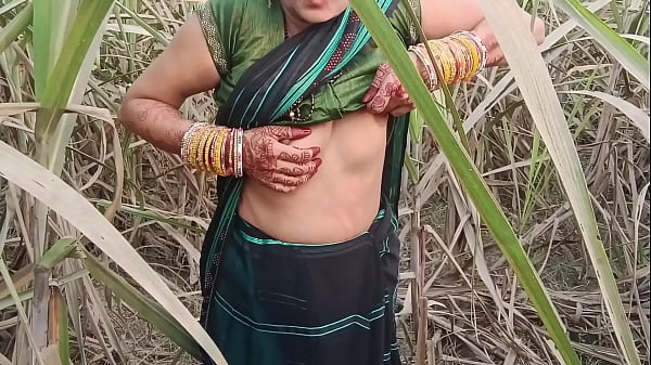 Desi village slut squats in the open field, hot piss streaming down her thighs for all to see